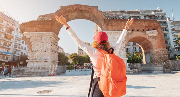 Photo of tourist enjoys the view of Galerius Arch in Thessaloniki city in Greece.
