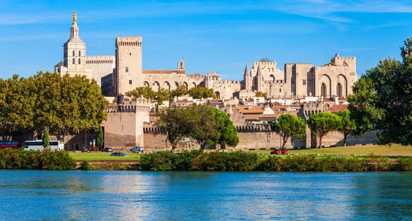 photo of Palace of the Popes (Palais des Papes), once fortress and palace, one of the largest and most important medieval Gothic buildings in Europe, at morning, Avignon, France.
