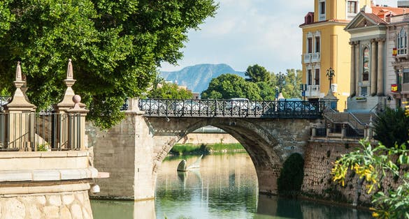Photo of Segura river and old bridge, Murcia, Spain.