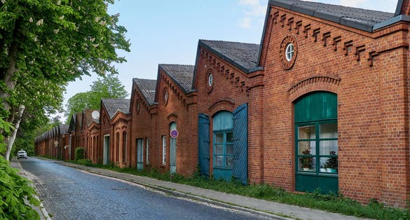 Photo of old traditional factory building of the former spinning mill in Delmenhorst (Germany) now used as apartment house .