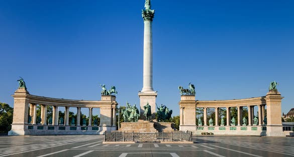 Photo of Heroes' Square, Hosok Tere or Millennium Monument, major attraction of city, with 36 m high Corinthian column in center, Budapest, Hungary. 