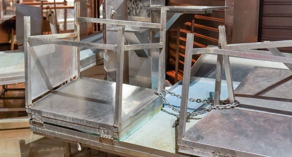 photo of Empty market food store stalls chained. Night view of indoors closed shops metal benches stacked at Kapani Market in Thessaloniki, Greece.,Thessaloniki  Greece.