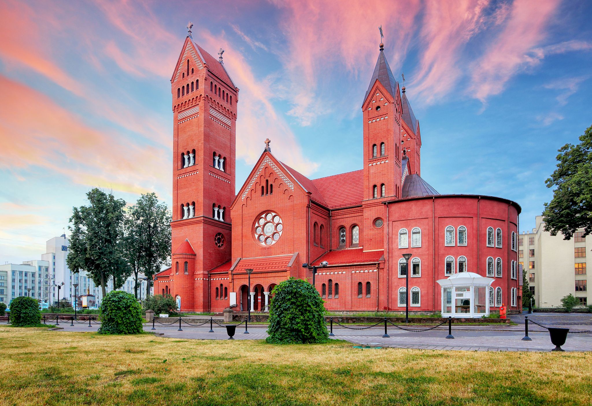 Photo of Red Church or Church Of Saints Simon and Helen at independence Square in Minsk with beautiful sky, Belarus.