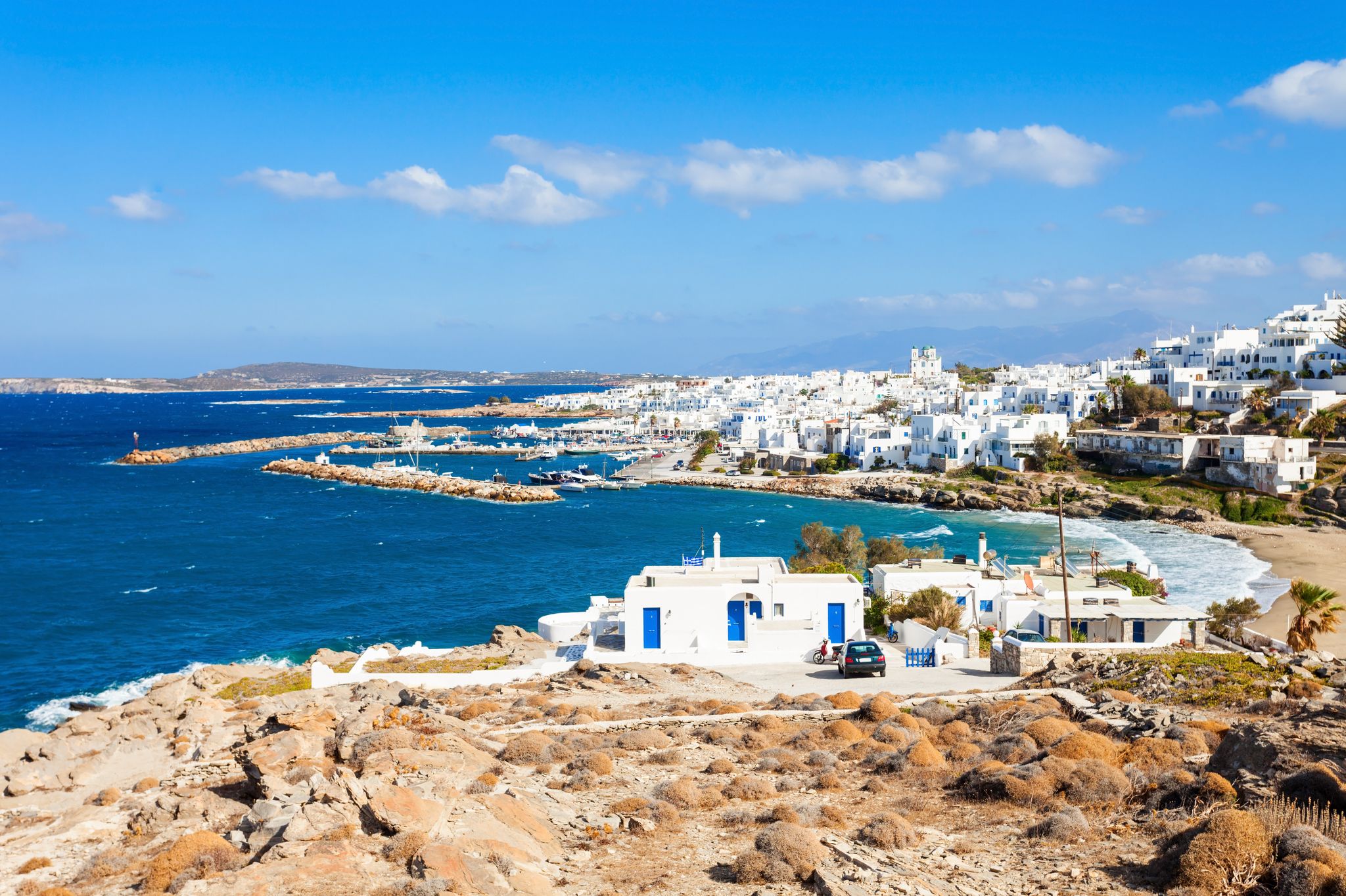 Photo of Parikia town aerial panoramic view with beach, Paros island in Greece.