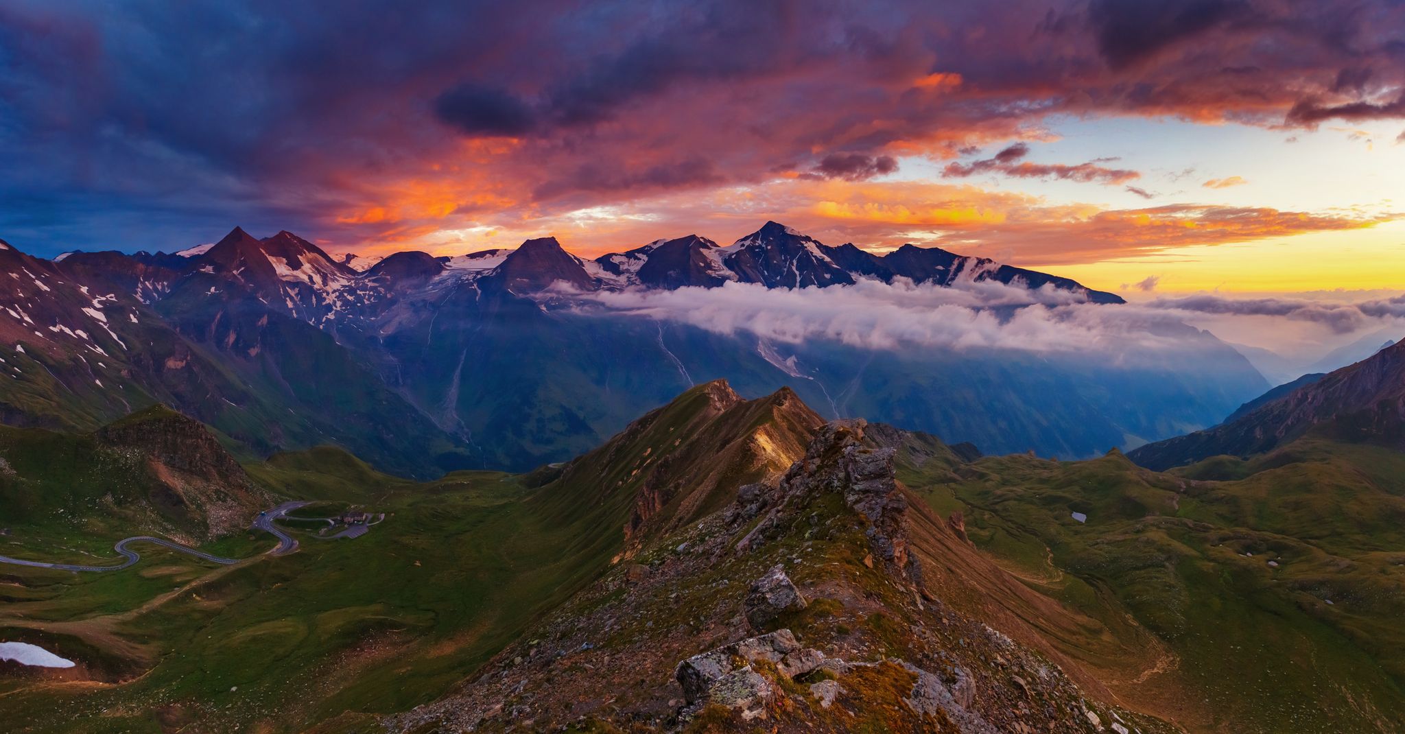 photo of  view of A great view of the hills glowing by sunlight at twilight. Dramatic and picturesque morning scene. Location famous Grossglockner High Alpine Road, Austria. Europe. Artistic picture. Beauty world.,Rauris Austria.