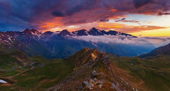 photo of  view of A great view of the hills glowing by sunlight at twilight. Dramatic and picturesque morning scene. Location famous Grossglockner High Alpine Road, Austria. Europe. Artistic picture. Beauty world.,Rauris Austria.