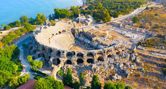 Photo of aerial view of the amphitheater in the ancient Side town, Antalya Province, Turkey.