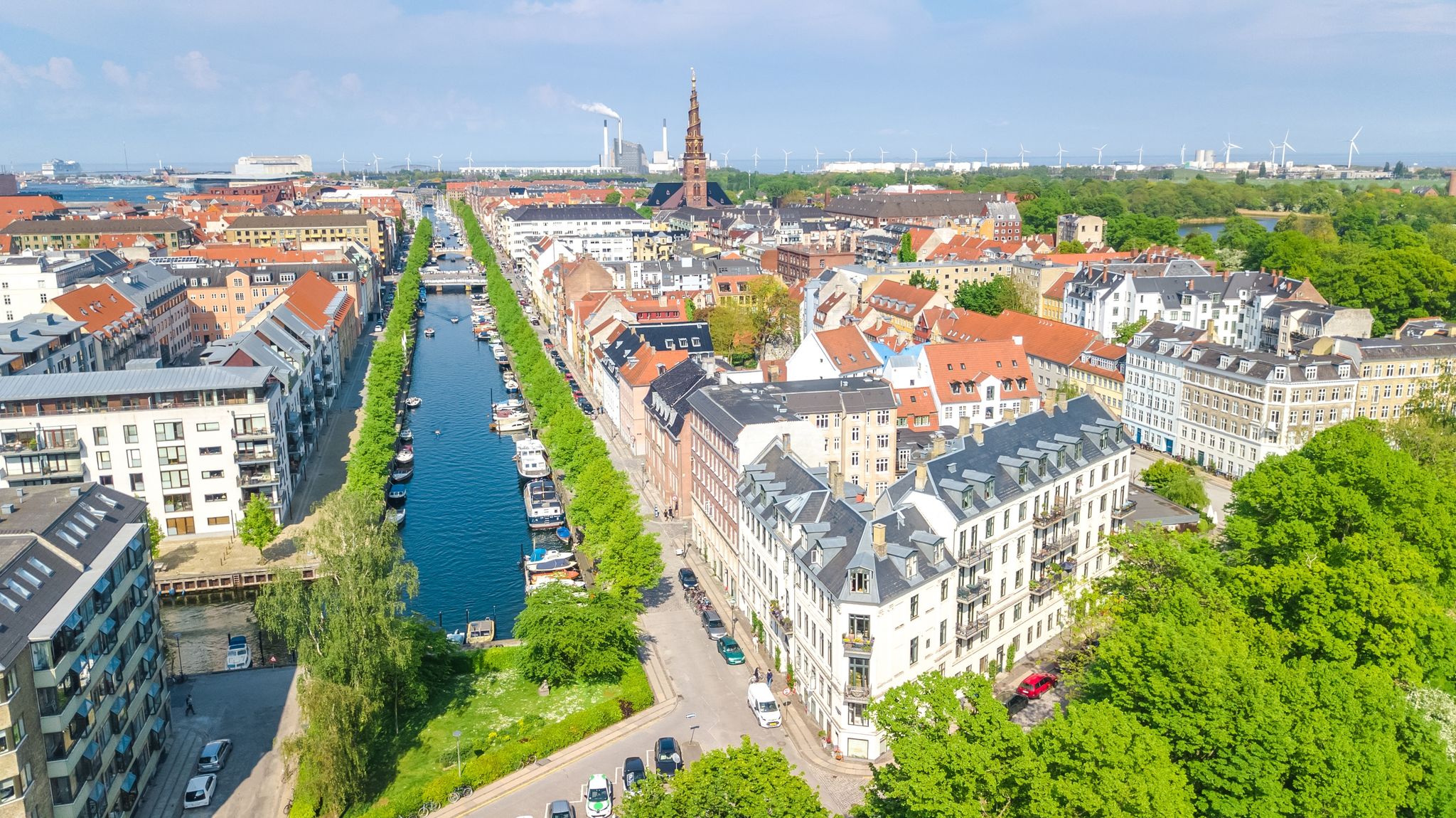 Photo of beautiful aerial view of Copenhagen skyline from above, Nyhavn historical pier port and canal with color buildings and boats, Denmark.