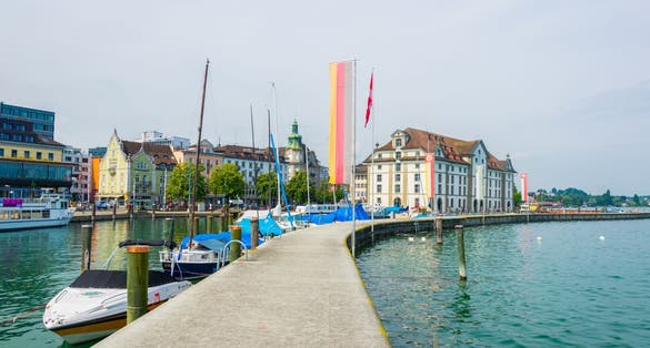 Photo of view of the Kornhaus building and adjacent marina in the swiss city Rorschach, Switzerland.