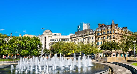 Photo of fountains at Piccadilly garden in Manchester city center, England.