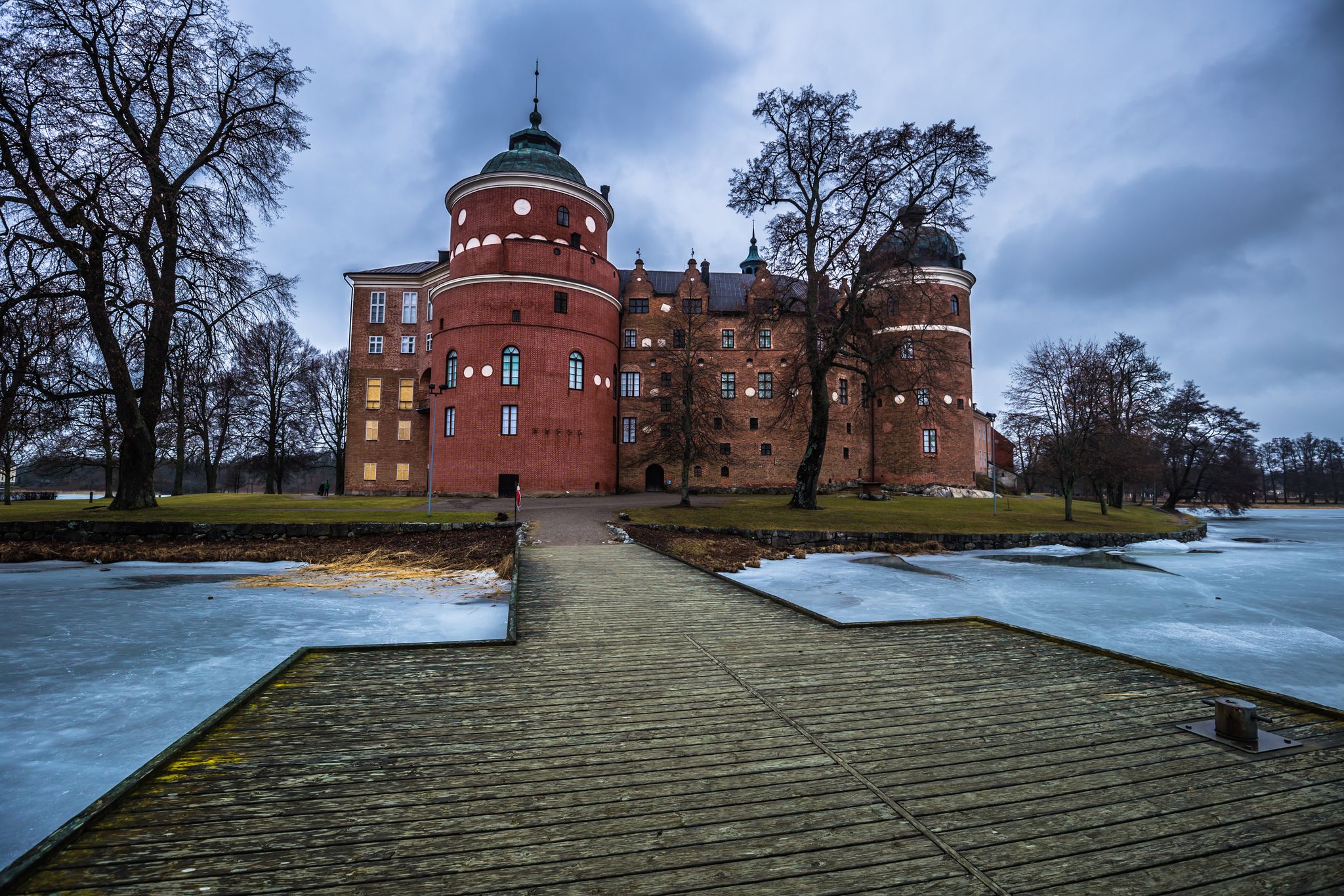 photo of view of Dock in the of castle of Gripsholm in Mariefred, Sweden (Cold color temperature and contrast for dramatic effect), Södermanland County, Sweden.