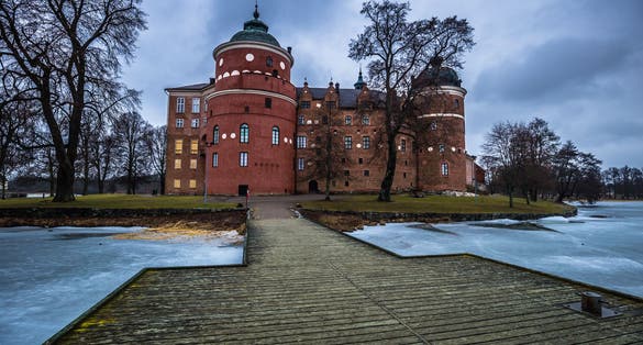 photo of view of Dock in the of castle of Gripsholm in Mariefred, Sweden (Cold color temperature and contrast for dramatic effect), Södermanland County, Sweden.