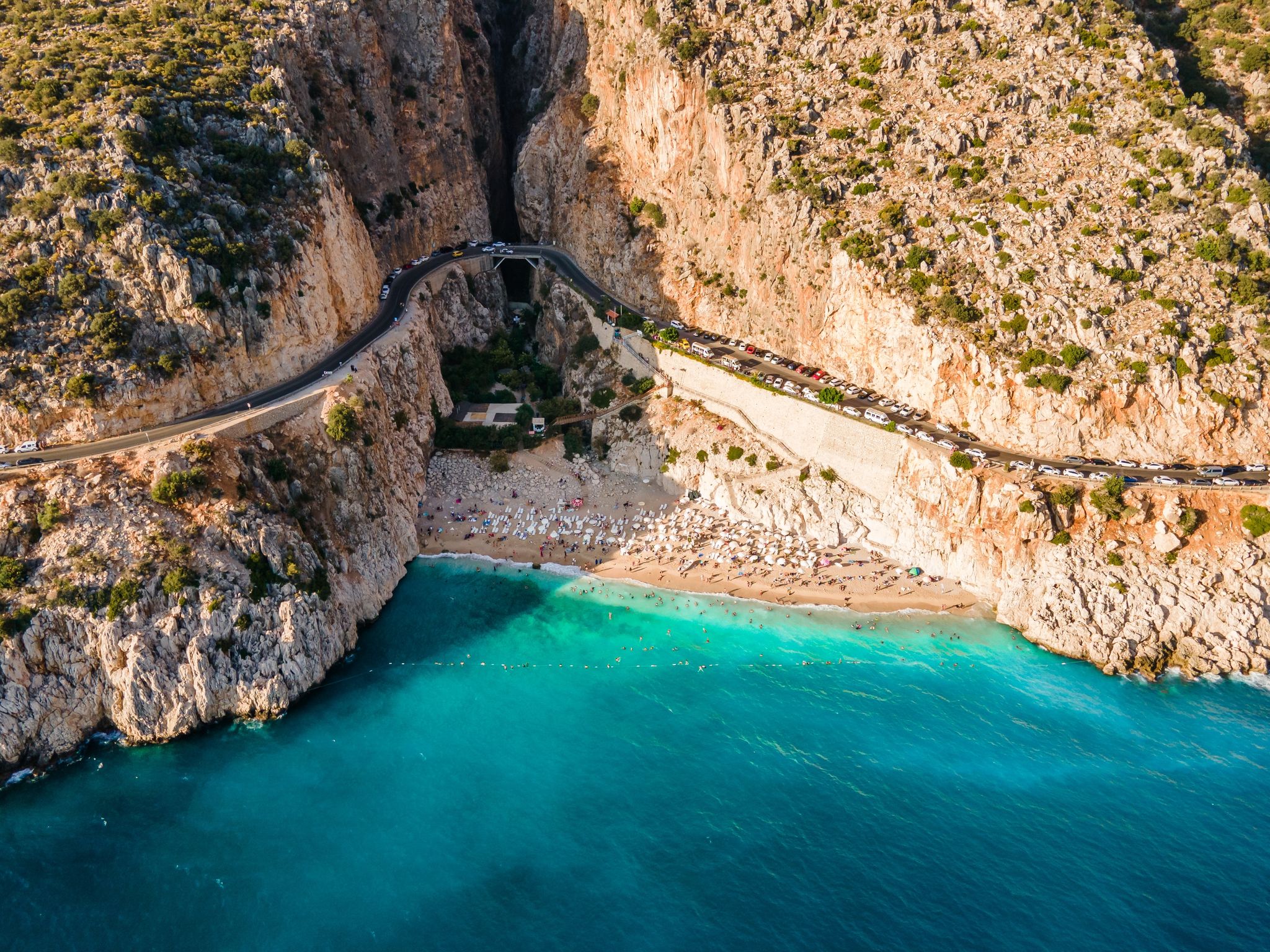 photo of drone footage of people sunbathing on Kaputaş beach near Kalkan - Kaş, Antalya, Turkey.