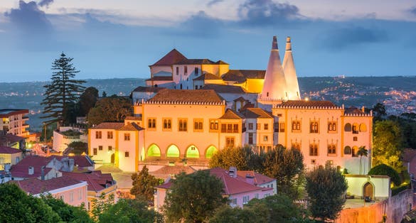 Photo of Palace of Sintra (Palacio Nacional de Sintra) in Sintra at night, Portugal.