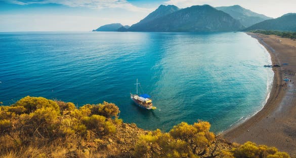 Photo from above to Cirali beach and Olimpos mountain in a sunset light. Kemer, Antalya.