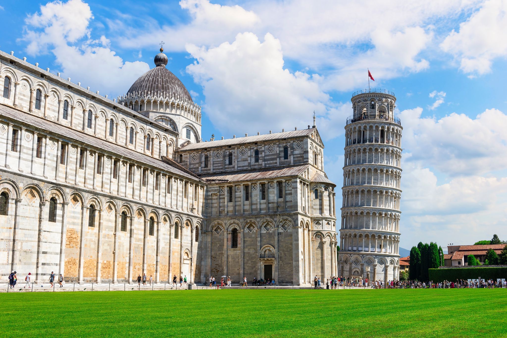 photo of Tower and cathedral, famous landmarks of Pisa, Italy .
