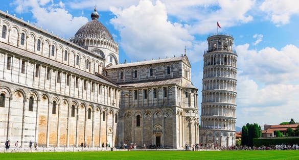 photo of Tower and cathedral, famous landmarks of Pisa, Italy .