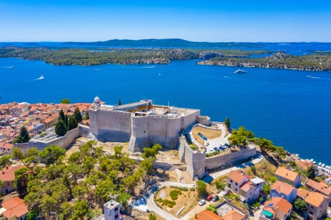 Photo of aerial view of Croatian town Sibenik with Saint michael's fortress and Sveti Ante channelز
