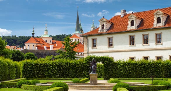 Photo of Waldstein palace garden (Valdstejnska Zahrada) and building of the Senate of Czech Republic in Prague.