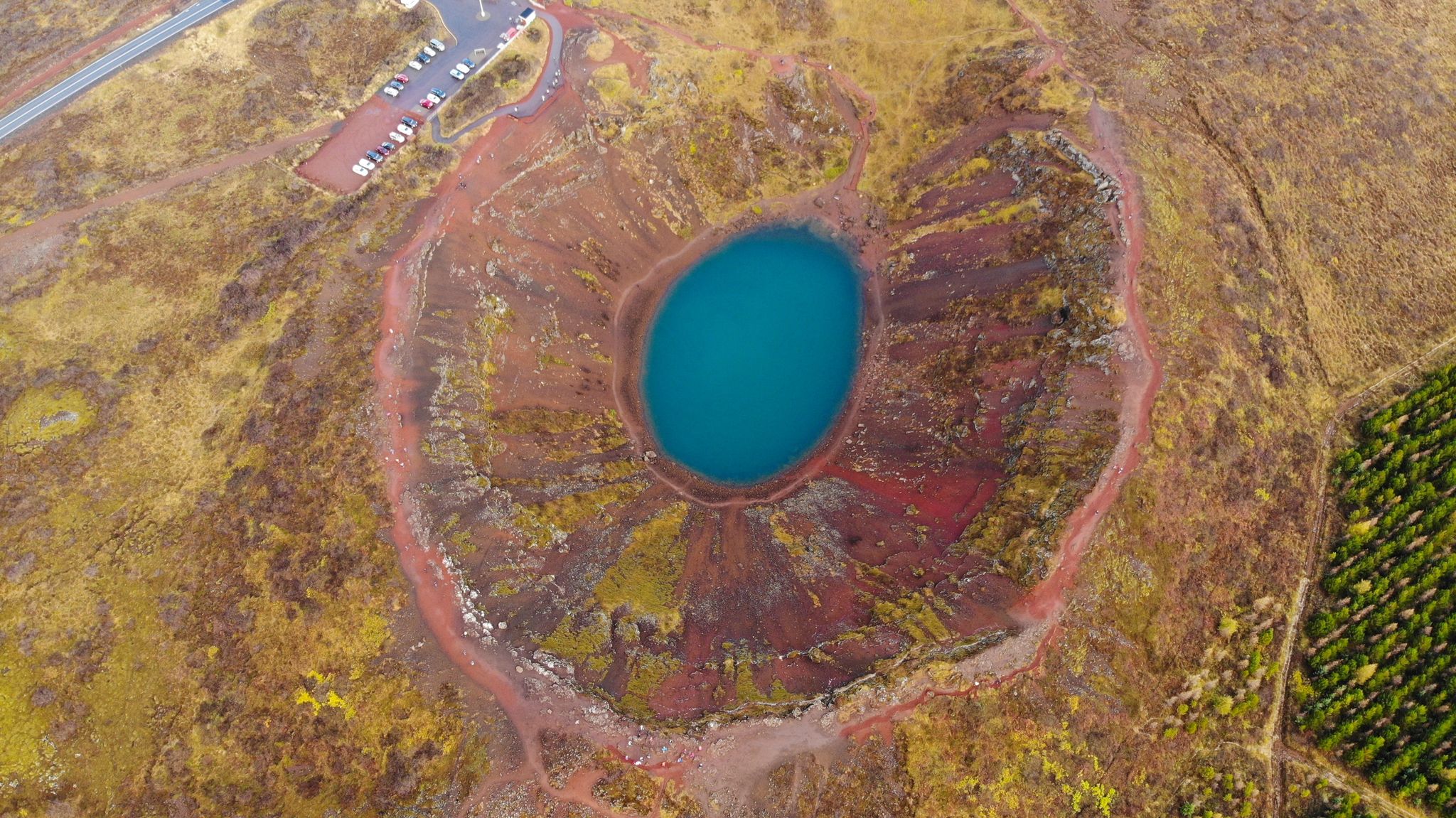 photo of aerial view of kerid, is a beautiful crater lake of a turquoise color located on the southwest of Iceland.