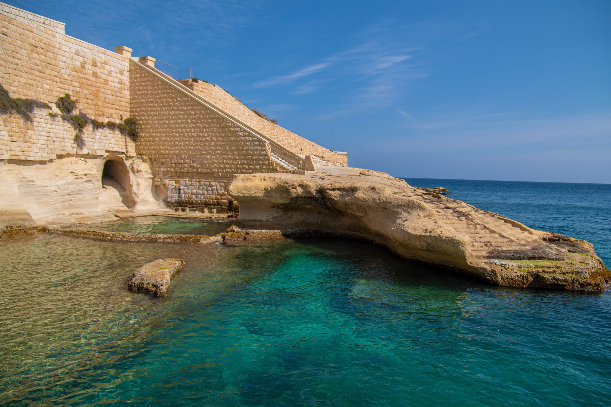Selective focus. Tigne Point beach (Tigné Point Beach) in Sliema, Malta