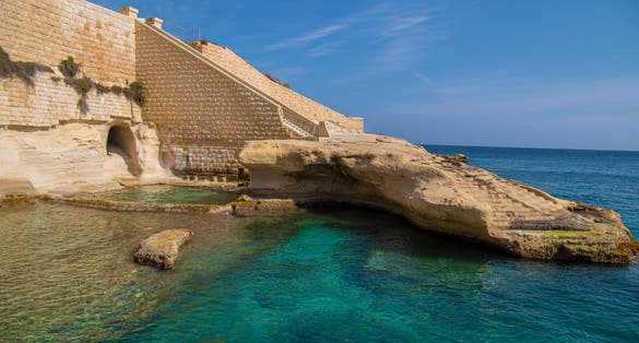 Selective focus. Tigne Point beach (Tigné Point Beach) in Sliema, Malta