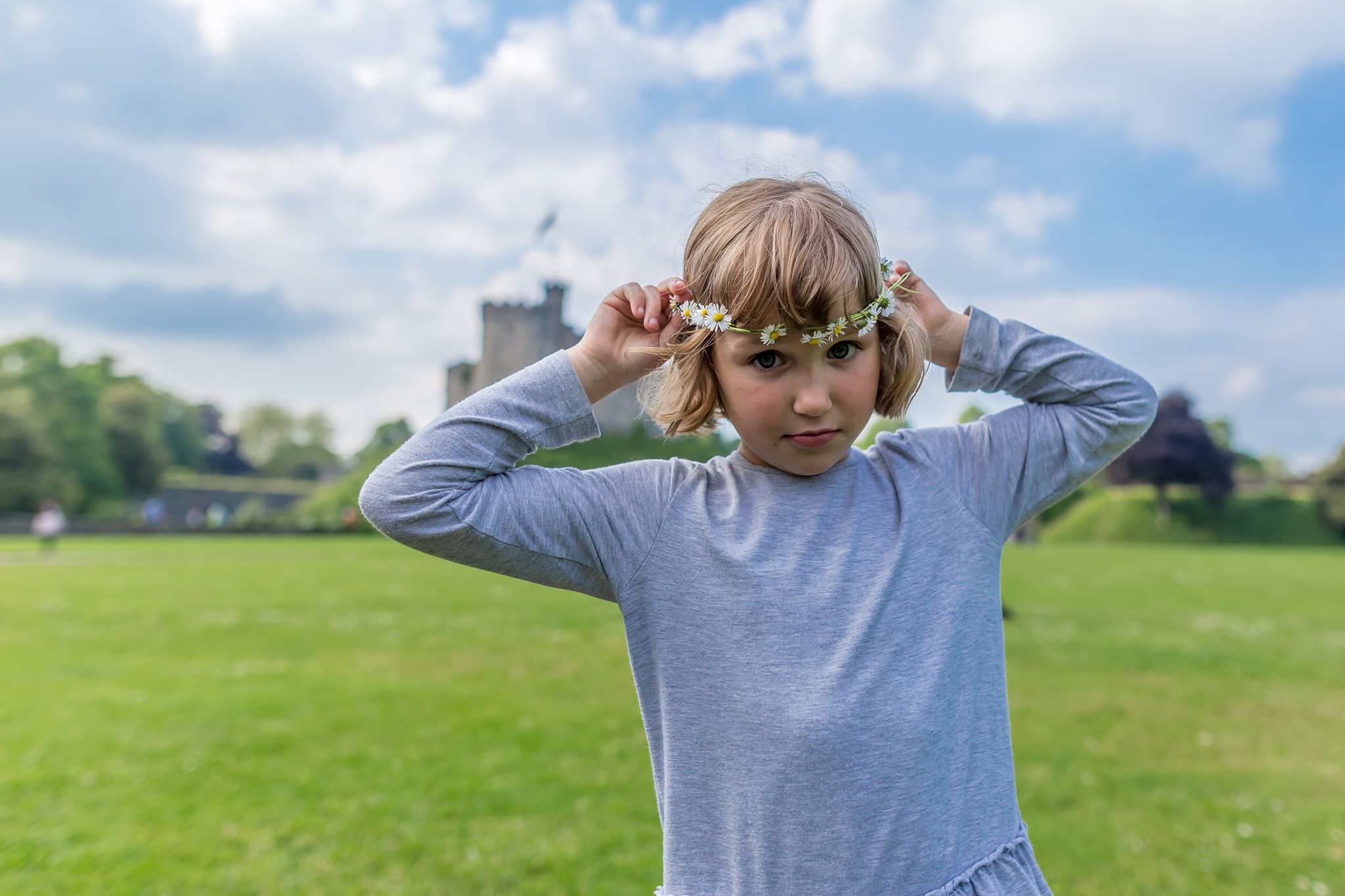 School girl with daisies in Cardiff castle, Wales