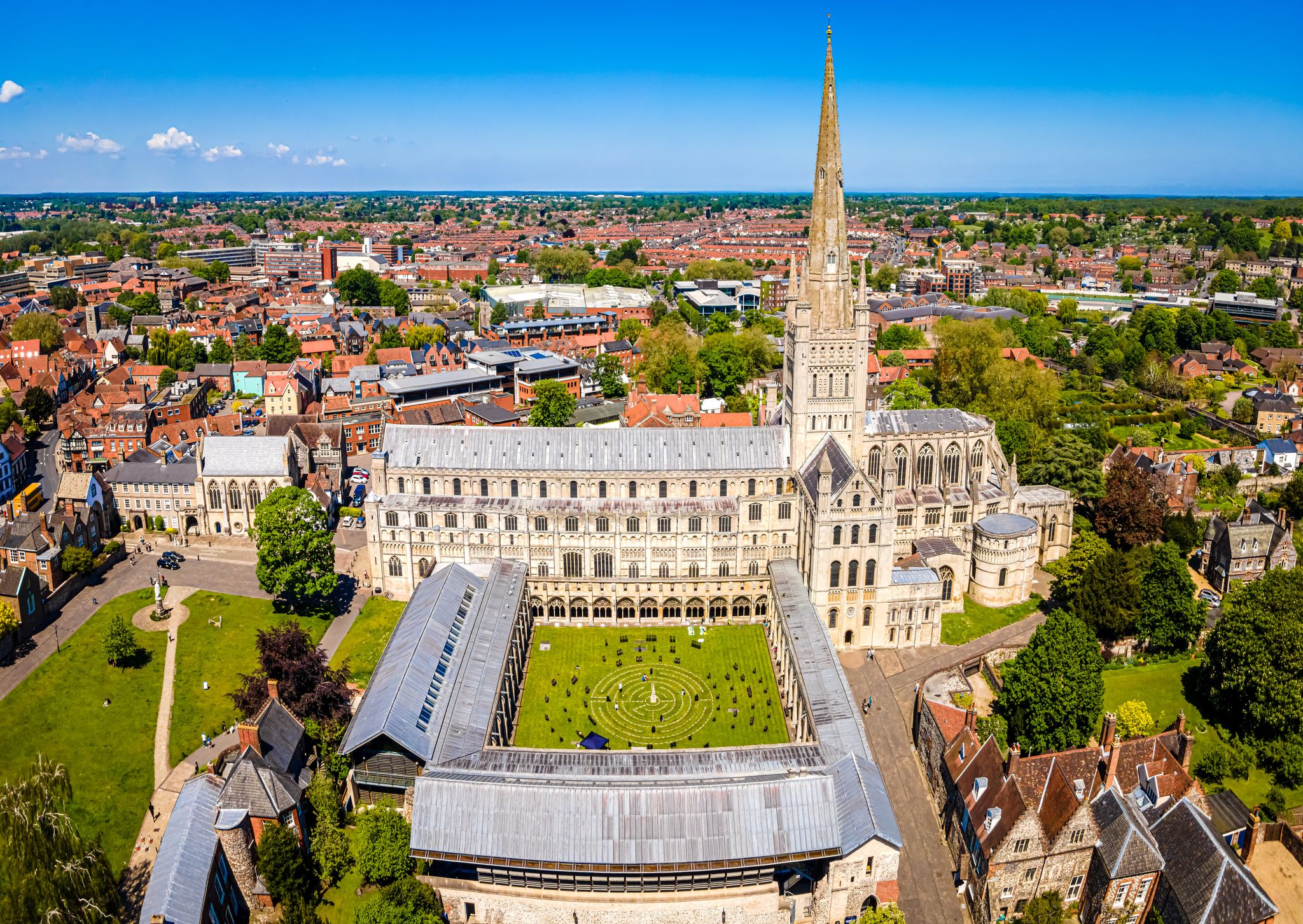 Photo of aerial view of the most famous place in Norwich, The Norwich Cathedral on a sunny day at Nowich, Norfolk, England.