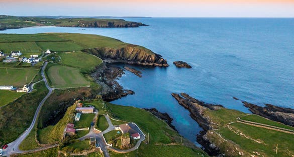 photo of view of Sunset scene at Galley Head Lighthouse in County Cork Ireland.