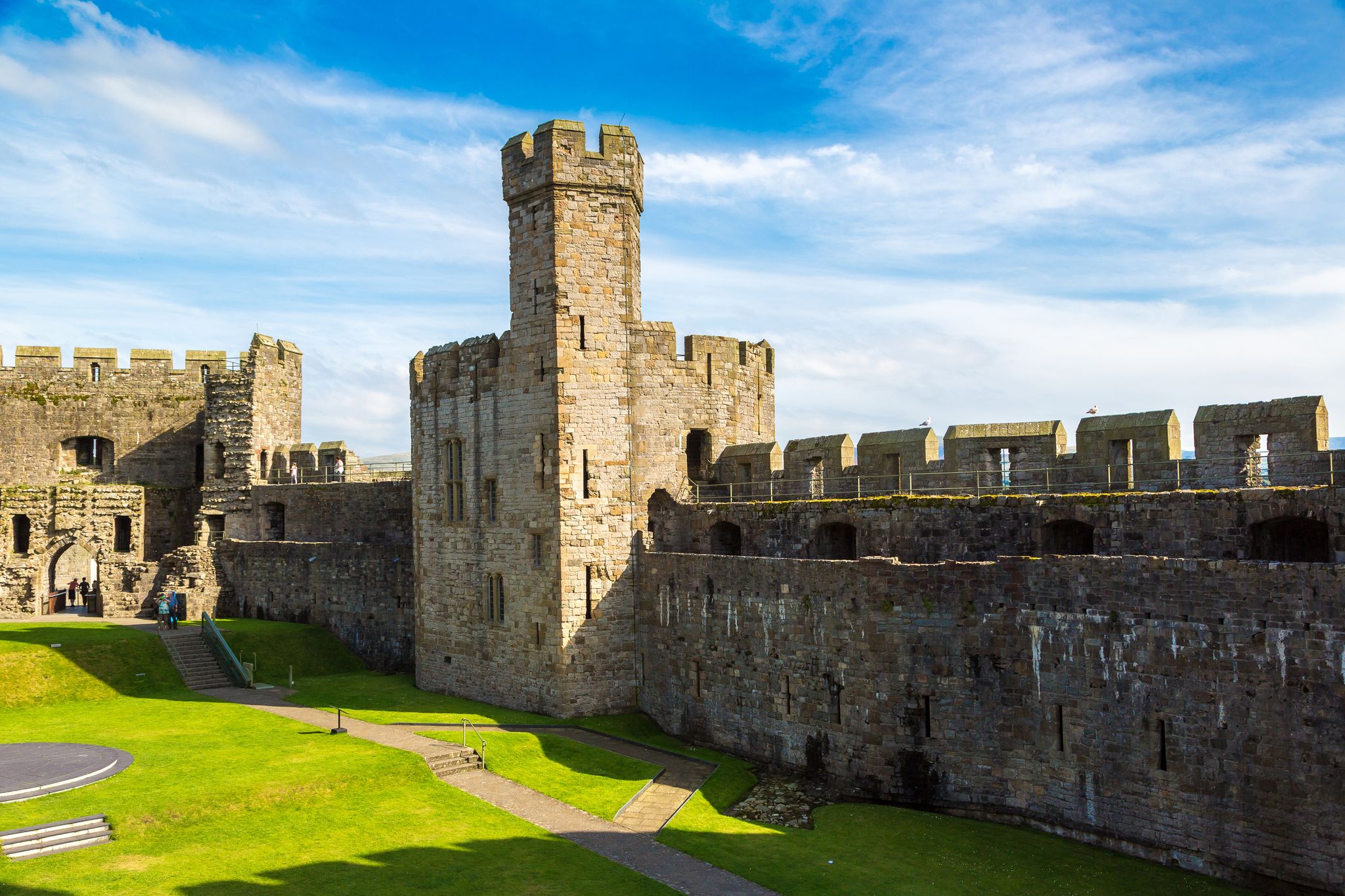 Photo of Caernarfon Castle in Wales in a beautiful summer day.