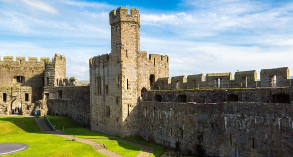 Photo of Caernarfon Castle in Wales in a beautiful summer day.