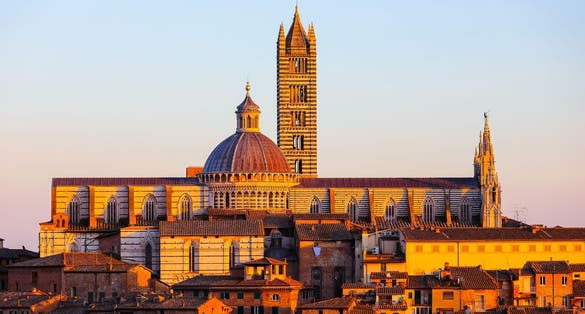 photo of view of Cathedral of the City of Siena in Tuscany region of Italy at sunset.