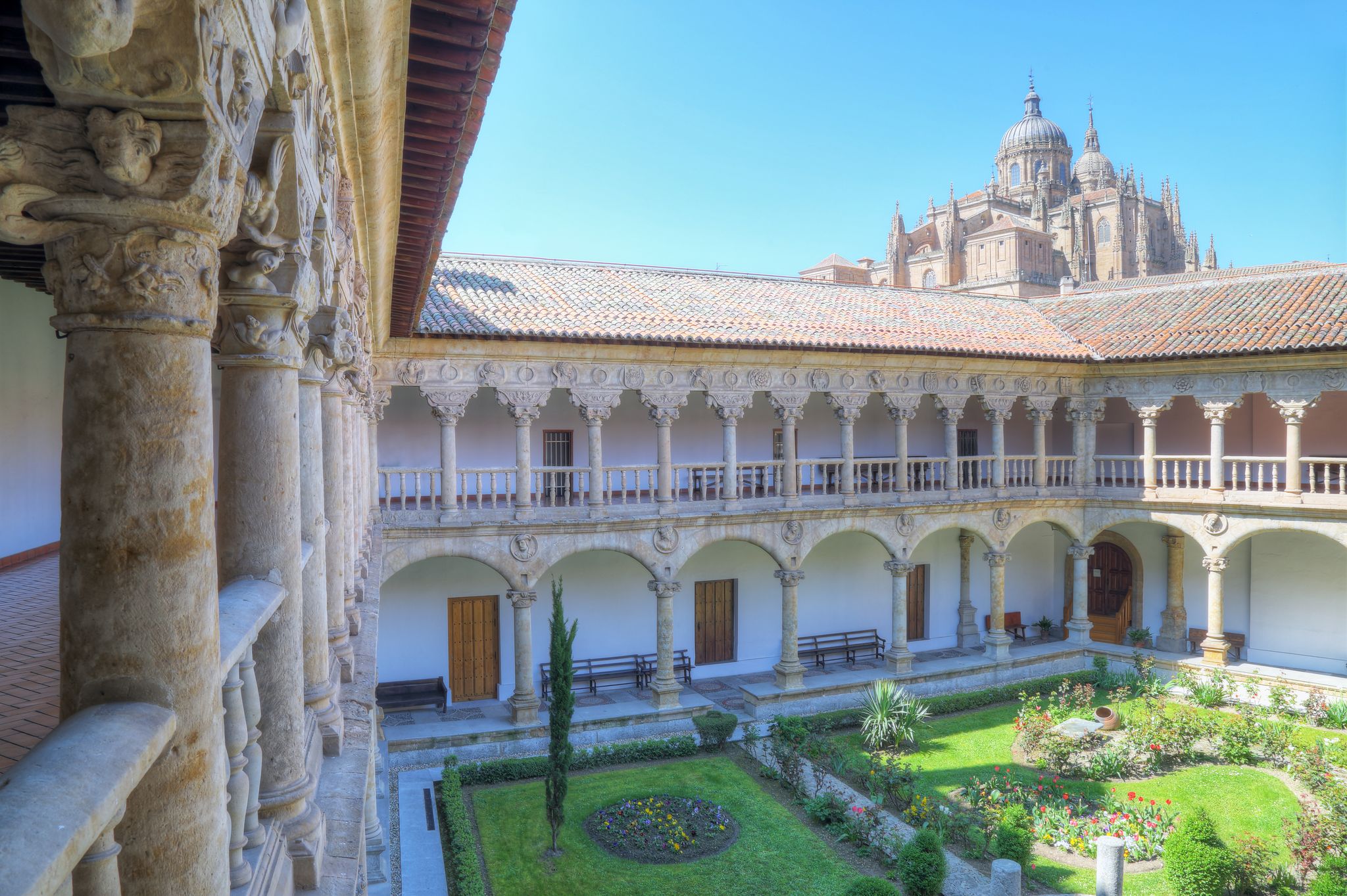 Photo of cloister of the convent of the owners with the cathedral in the background in Salamanca, Spain.