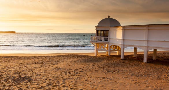 Pier promenade view at sunset. Cadiz, Spain.