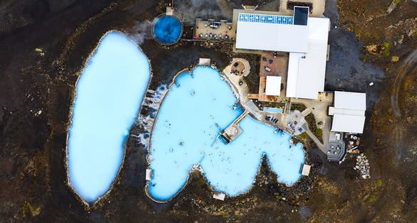 photo of Blue lagoon in Iceland. Most famous and popular place in Iceland. Wellness and spa. Landscape from air. Vacation image. Blue and hot water in geothermal lake. Icelandic nature. View from drone.