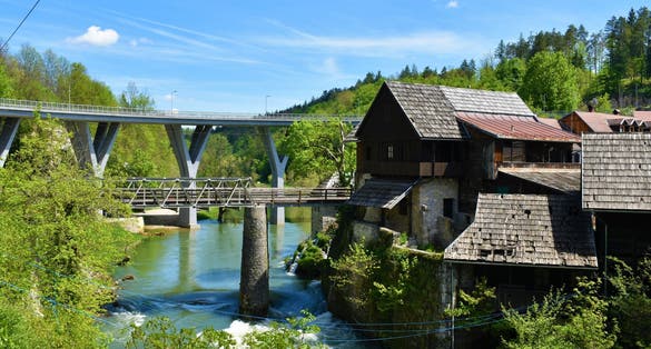 photo of view of Old buildings in Slunj town with bridges over Korana river in Karlovac county, Croatia