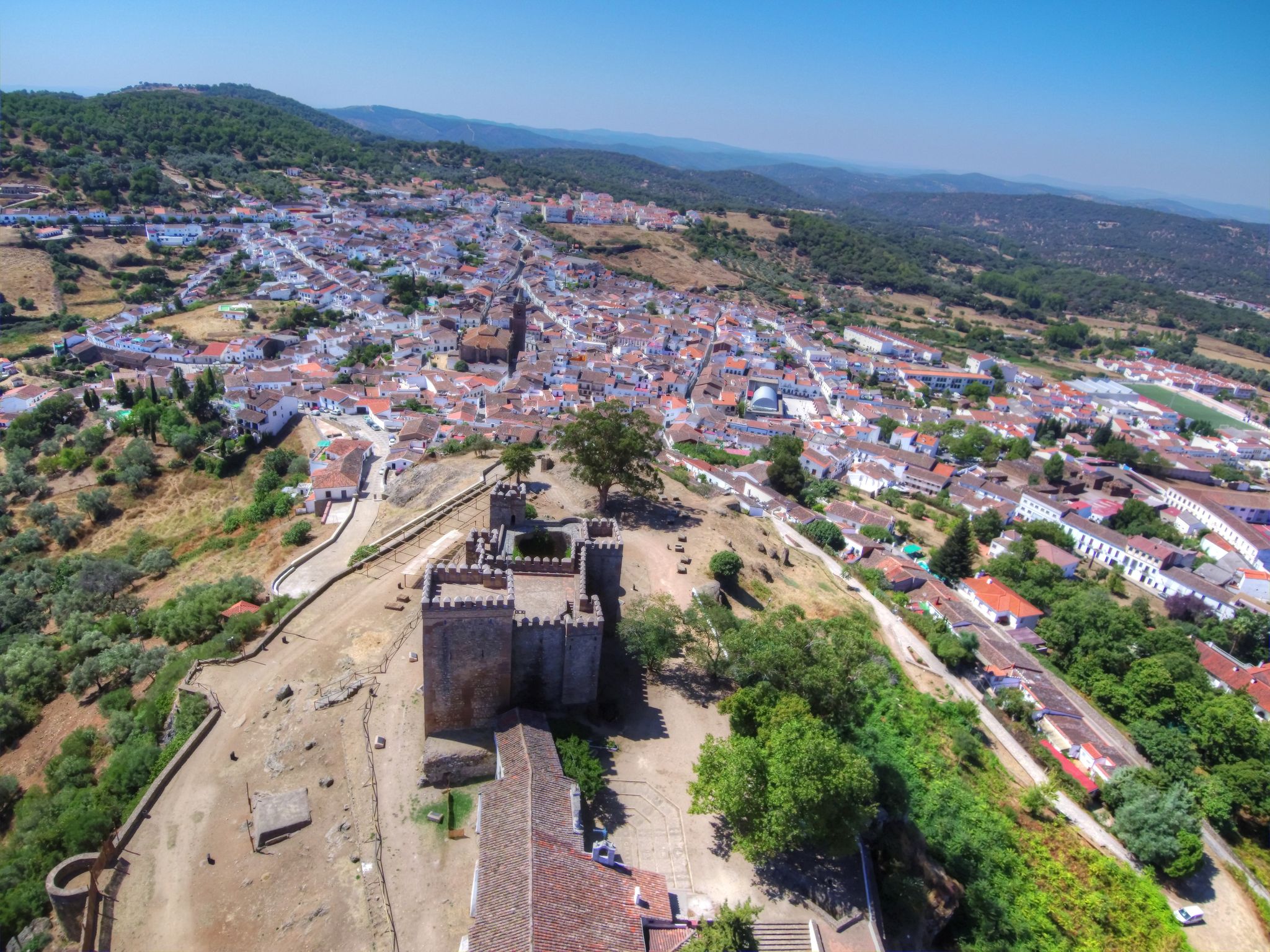 photo of aerial view of the beautiful Cortegana Castle in Huelva, Spain.
