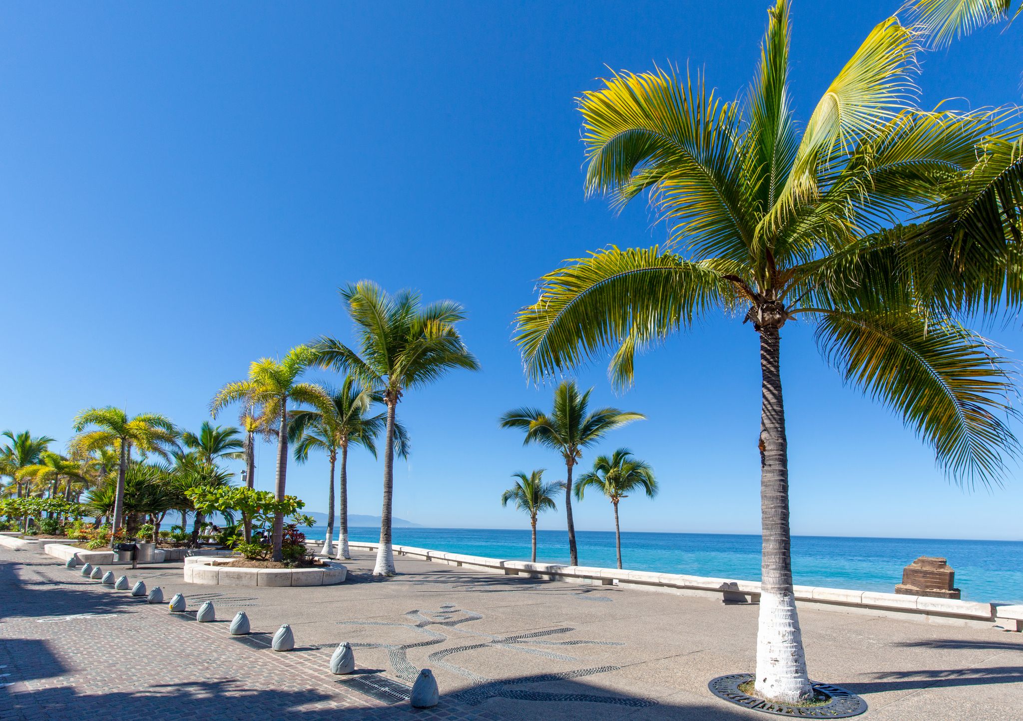 Photo of Puerto Vallarta sea promenade, El Malecon, with ocean lookouts, beaches, scenic landscapes hotels and city views .