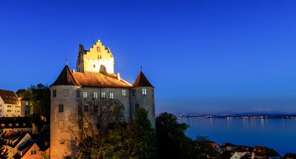 photo of panorama of castle Meersburg at night, Lake Constance, Baden Wuertemberg, Germany.