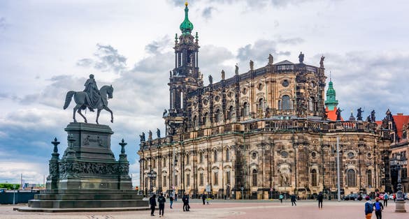 Dresden Cathedral (Katholische Hofkirche) and King Johann Statue on Theaterplatz square, Dresden, Germany