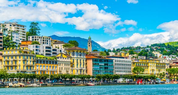 Photo of old town of Lugano facing the Lugano lake in Switzerland.