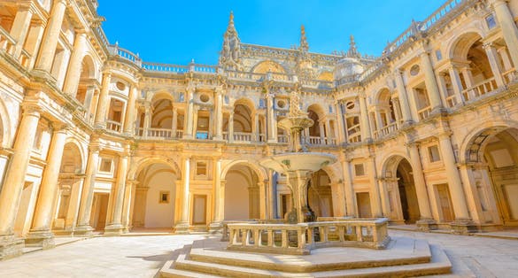 Photo of bottom view of claustro de D. Joao III, courtyard with fountain of Convent of Christ in Templar Castle, Tomar ,Portugal. 