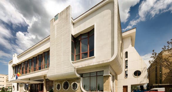 Postmodern train station in Targu Jiu, Romania, a building inspired by Constantin Brancusi modern sculpture.
