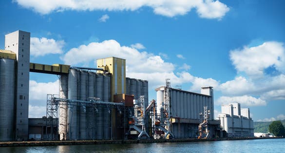 Photo of big grain storage silos in the port of Rouen in France.