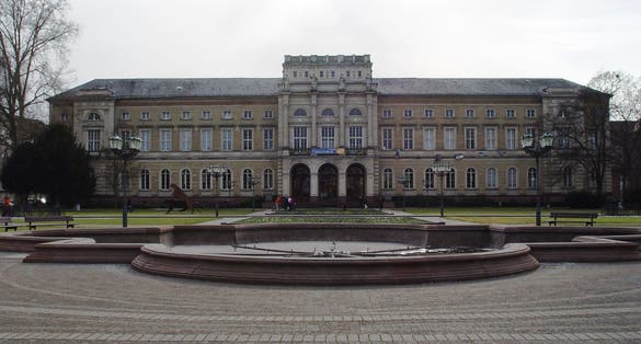 photo of view Karlsruhe, Germany - 20 June 2019: Pteranodon dinosaur standing in front of State Museum of Natural History Karlsruhex, Karlsruhe, Germany.