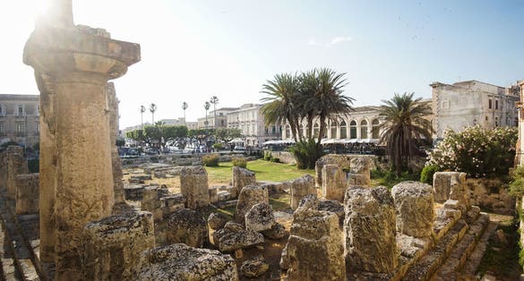 Stunning view of Tempio di Apollo on the sunset. Ancient Greek monument in Ortigia, Syracuse, Sicily, Italy.