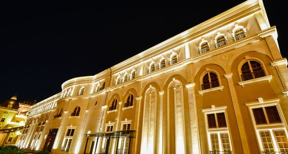 Photo of beautiful view of Museum of the Macedonian Struggle building at night in Skopje, Macedonia.