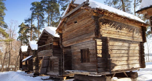 Photo of Rustic wooden house in the open-air museum Seurasaari island, Helsinki, Finland.