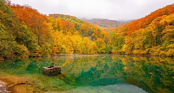 photo of view of Nice lake at Szalajka Valley, Hungary in autumn .