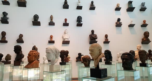 Photo of Kumu museum of Modern Art. Famous historical people bust sculptures.